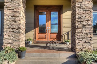 front entry with cultures stone and beautiful solid stained doors