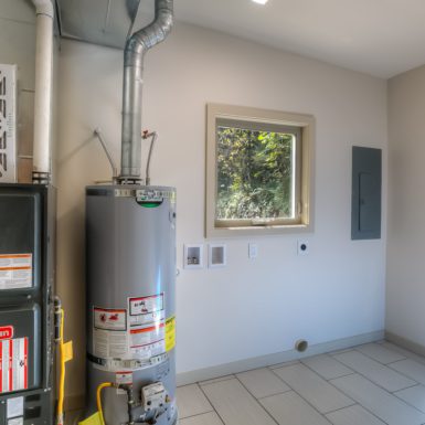Utility and Laundry Room with furnace and water heater.
