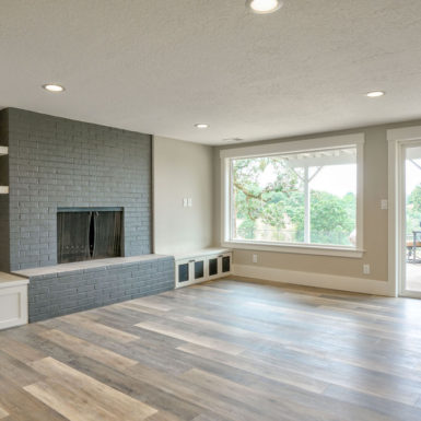living room with dark fireplace wall