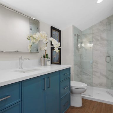 Bathroom Wood Flooring Custom Cabinet White Countertop Chrome Fixtures