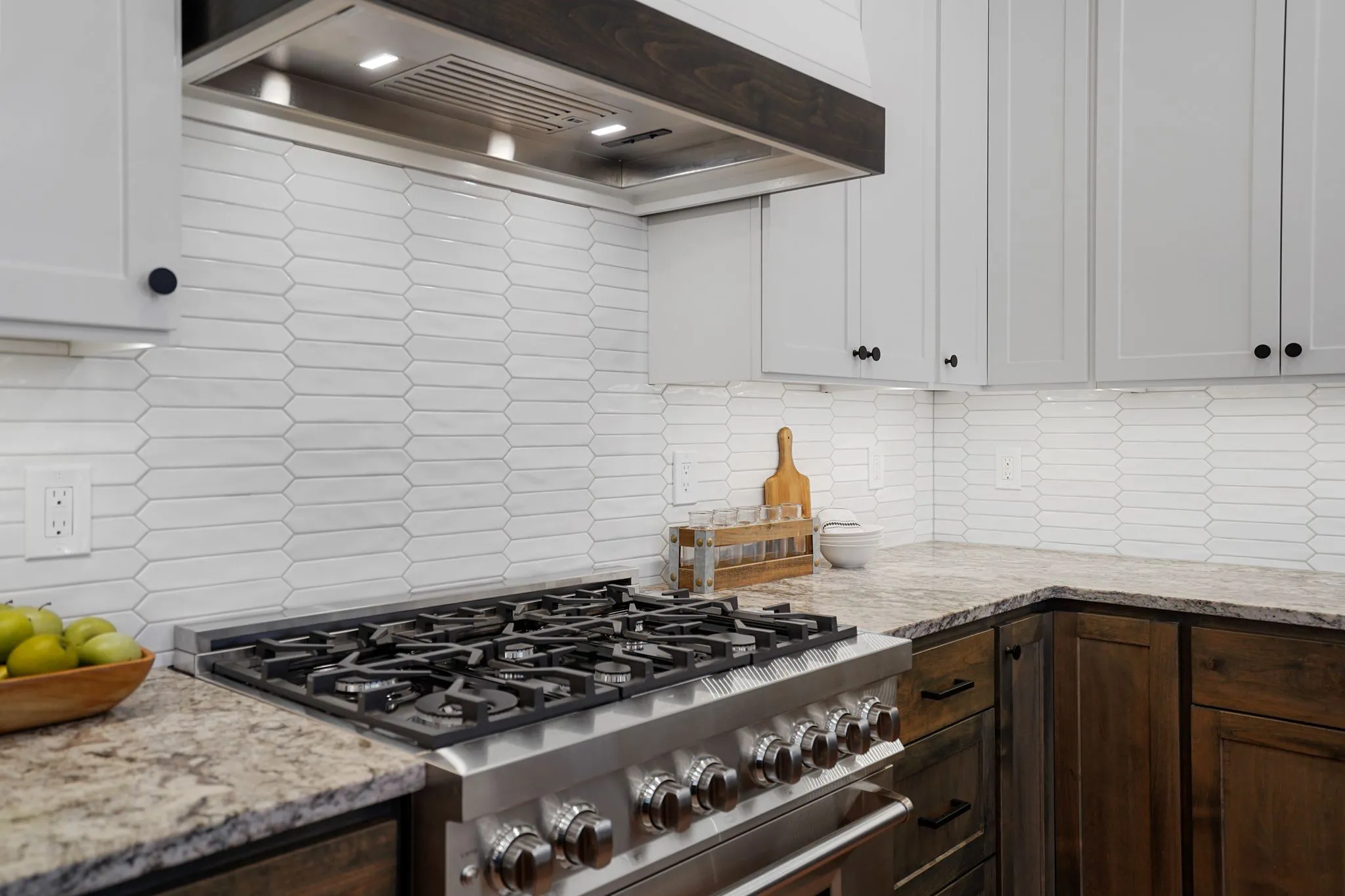 Kitchen Gas Stove With White Tile Backsplash And Plenty Of Counter Space