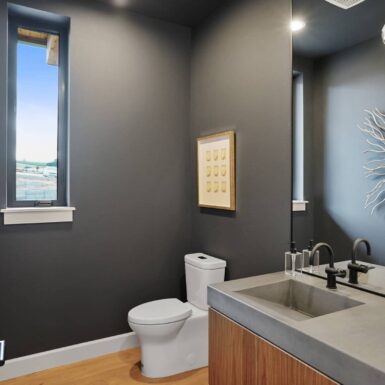 dark paint, grey counter, black fixtures bathroom 2023 Tour of Homes by Foksha Homes in Salem Oregon