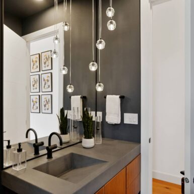 dark paint, grey counter, black fixtures bathroom 2023 Tour of Homes by Foksha Homes in Salem Oregon