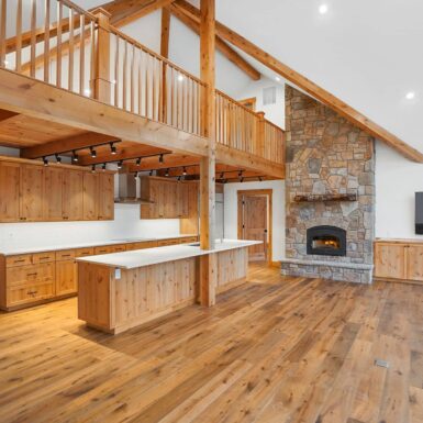 Kitchen located under second floor landing with plenty of counter space and cabinet storage with clear stain wood trim