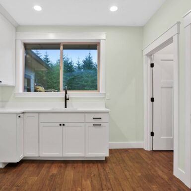 laundry room white cabinets