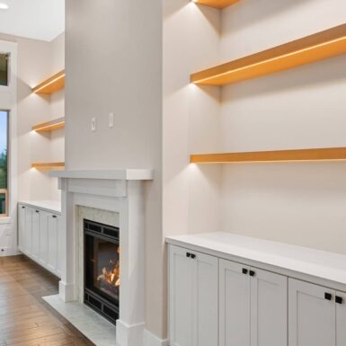 living room floating shelves with fire place